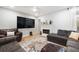 Living room with sectional sofa, fireplace, and large TV at 6412 Wedgeview Dr, Tucker, GA 30084