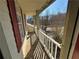 Wooden deck balcony overlooking backyard and trees at 1402 Chelsea Downs Ne Ln, Conyers, GA 30013