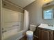 Full bathroom with tub shower combo, toilet, and vanity at 1402 Chelsea Downs Ne Ln, Conyers, GA 30013