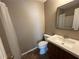 Clean bathroom, includes a vanity with sink, toilet, and shower at 1402 Chelsea Downs Ne Ln, Conyers, GA 30013