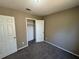 Spacious bedroom with neutral walls and carpet at 1402 Chelsea Downs Ne Ln, Conyers, GA 30013