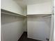 Large walk-in closet with double hanging rods and shelving at 1402 Chelsea Downs Ne Ln, Conyers, GA 30013