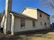 Two-story house with light beige siding at 1402 Chelsea Downs Ne Ln, Conyers, GA 30013