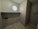 Laundry room with shelving and tile floor at 1402 Chelsea Downs Ne Ln, Conyers, GA 30013