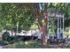 Quaint gazebo shaded by lush trees in a well-maintained park-like setting at 217 Wakehurst Way, Marietta, GA 30064