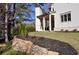 Landscaped backyard with retaining wall and lush greenery at 217 Wakehurst Way, Marietta, GA 30064