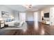 Spacious primary bedroom with hardwood floors and large windows at 5490 Powers Overlook Ct, Atlanta, GA 30327