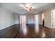 Bright bedroom with hardwood floors and ceiling fan at 5490 Powers Overlook Ct, Atlanta, GA 30327