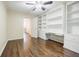 Bedroom with hardwood floors and built-in shelving at 5490 Powers Overlook Ct, Atlanta, GA 30327