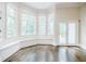 Breakfast nook with built-in window seat and hardwood floors at 5490 Powers Overlook Ct, Atlanta, GA 30327