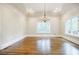 Formal dining room with hardwood floors and large windows at 5490 Powers Overlook Ct, Atlanta, GA 30327