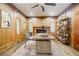 Home office with wood walls, fireplace, and built-in shelves at 5490 Powers Overlook Ct, Atlanta, GA 30327