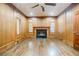 Spacious home office with wood walls and a fireplace at 5490 Powers Overlook Ct, Atlanta, GA 30327