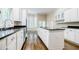 Modern kitchen with white cabinets, granite countertops at 5490 Powers Overlook Ct, Atlanta, GA 30327