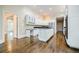 Kitchen with white cabinets, granite countertops and hardwood floors at 5490 Powers Overlook Ct, Atlanta, GA 30327