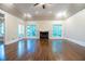 Large living room with hardwood floors and a fireplace at 5490 Powers Overlook Ct, Atlanta, GA 30327
