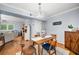 Charming dining room with wooden table and view into the living room at 3660 Peachtree Ne Rd # 6A, Atlanta, GA 30319