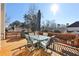 Relaxing deck with table and chairs, offering scenic backyard views at 7130 Fawn Lake Dr, Alpharetta, GA 30005