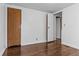 Bedroom with hardwood floors and access to other rooms at 3935 Loganville Hwy, Loganville, GA 30052