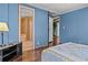 Blue bedroom with a view of the bathroom at 3935 Loganville Hwy, Loganville, GA 30052