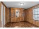 Room with wood paneled walls and hardwood floors at 3935 Loganville Hwy, Loganville, GA 30052