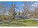 Mobile home on a grassy lot with trees at 3935 Loganville Hwy, Loganville, GA 30052