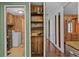 Laundry area with washer, dryer, and built-in shelving at 3935 Loganville Hwy, Loganville, GA 30052