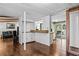 Open living area with hardwood floors and a view into the kitchen at 3935 Loganville Hwy, Loganville, GA 30052