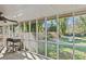Screened porch with grilling station and backyard view at 3935 Loganville Hwy, Loganville, GA 30052