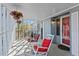 Screened porch with rocking chairs and hanging plants at 3935 Loganville Hwy, Loganville, GA 30052