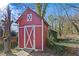 Red storage shed with white accents at 3935 Loganville Hwy, Loganville, GA 30052