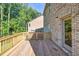 Wood deck featuring access to backyard of home that has brick exterior and walk out basement at 741 Cams Crk, Mcdonough, GA 30253
