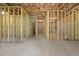 Unfinished basement featuring stud framing, concrete floor, utility hook ups and access to other rooms at 741 Cams Crk, Mcdonough, GA 30253