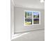Bright bedroom with large window offering neighborhood views and lots of natural light at 741 Cams Crk, Mcdonough, GA 30253