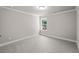 Bedroom featuring a window, light gray walls, plush carpet, and white trim at 741 Cams Crk, Mcdonough, GA 30253