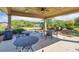 Common area covered patio featuring multiple tables and chairs and manicured landscaping at 741 Cams Crk, Mcdonough, GA 30253