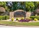 Elegant stone community sign for 'The Estates at Cameron Manor' surrounded by lush landscaping and decorative stones at 741 Cams Crk, Mcdonough, GA 30253