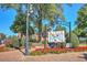 Picturesque downtown square with a Scarecrow Sponsors sign, colorful flowers, and brick walkways at 741 Cams Crk, Mcdonough, GA 30253