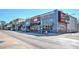 Lively downtown street featuring local businesses and restaurants with colorful storefronts and street parking at 741 Cams Crk, Mcdonough, GA 30253