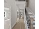 Spacious foyer with hardwood floors, staircase with iron balusters, and archway leading to living area at 741 Cams Crk, Mcdonough, GA 30253