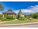 Landscaped grounds featuring gazebo structure, water feature, mature trees and shrubs and concrete sidewalk at 741 Cams Crk, Mcdonough, GA 30253
