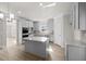 Modern kitchen features gray cabinets, granite countertops, stainless appliances, and center island at 741 Cams Crk, Mcdonough, GA 30253