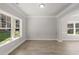 Bright living room with large windows, hardwood floors, and elegant trim at 741 Cams Crk, Mcdonough, GA 30253