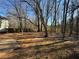 Wooded backyard with large trees and open space at 916 Brisley Cir, Hampton, GA 30228