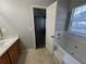 Bathroom with tub, vanity, and access to bedroom at 916 Brisley Cir, Hampton, GA 30228