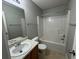 Clean bathroom with tub, shower, sink, and toilet at 916 Brisley Cir, Hampton, GA 30228