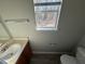 Simple bathroom with single sink vanity and vinyl flooring at 916 Brisley Cir, Hampton, GA 30228