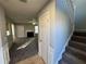 Bright entryway with stairs, coat closet, and view of living room at 916 Brisley Cir, Hampton, GA 30228