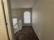 Upstairs hallway with window and carpeted flooring at 916 Brisley Cir, Hampton, GA 30228