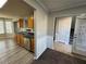 Kitchen with wood cabinets, stainless steel appliances, and vinyl flooring at 916 Brisley Cir, Hampton, GA 30228